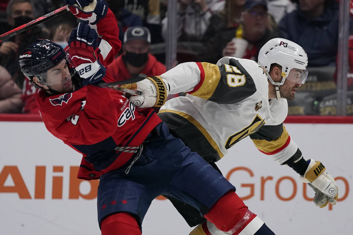 Vegas Golden Knights left wing William Carrier (28) fights for position against Washington Capi ...