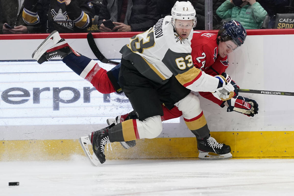 Vegas Golden Knights right wing Evgenii Dadonov (63) takes the puck away from Washington Capita ...