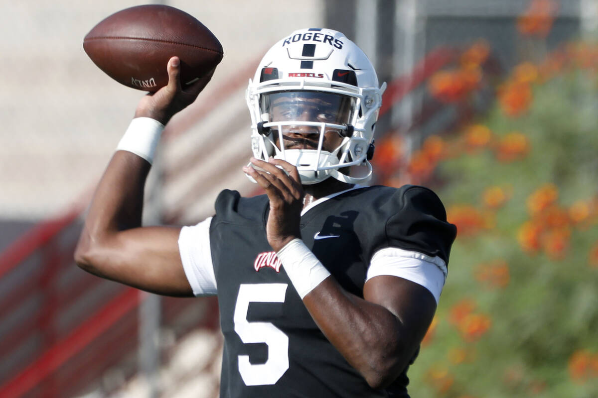 UNLV Rebels quarterback Justin Rogers (5) throws a ball during football practice in UNLV, Wedne ...