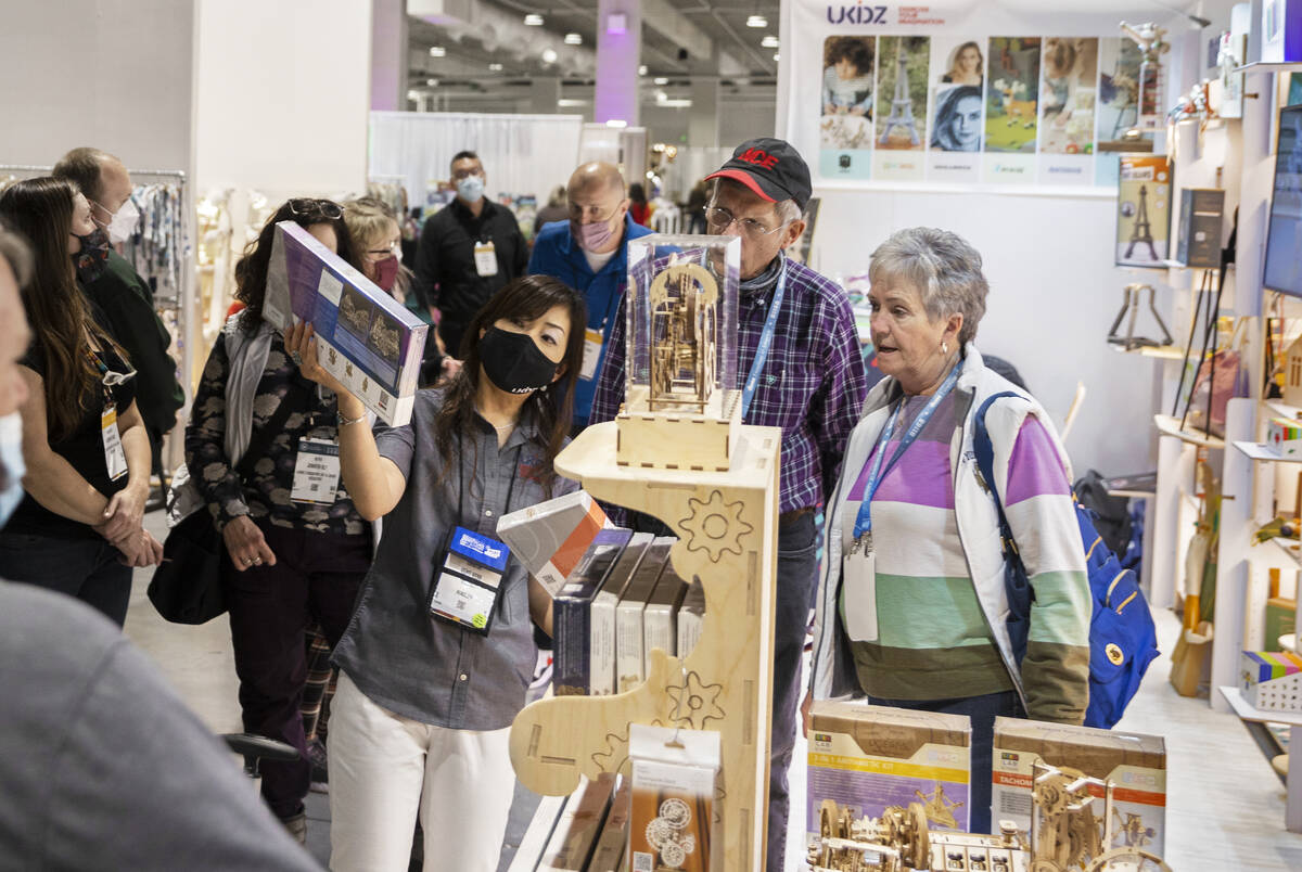 Keiko Webb, middle, with Ukidz LLC, talks with conventiongoers during the Las Vegas Market at W ...