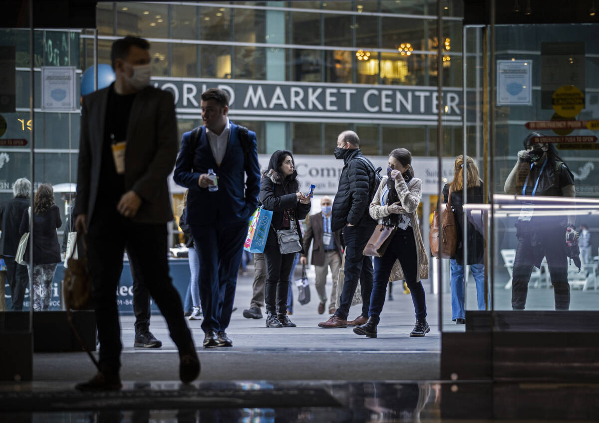 Conventiongoers walk in the courtyard during the Las Vegas Market at World Market Center Las Ve ...