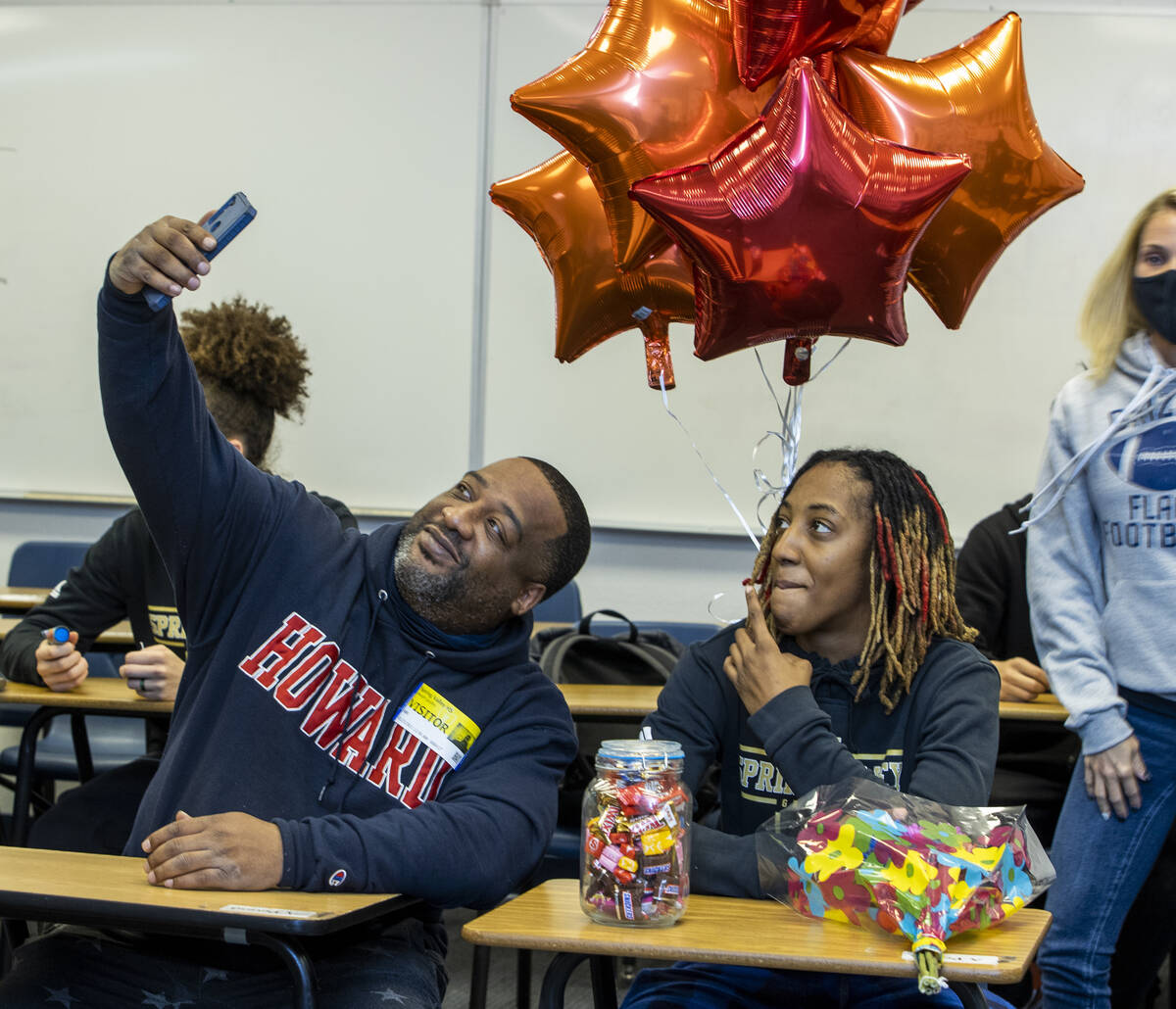 Spring Valley High School basketball guard Aaliyah Gayles, right, takes a “selfie&#x201d ...