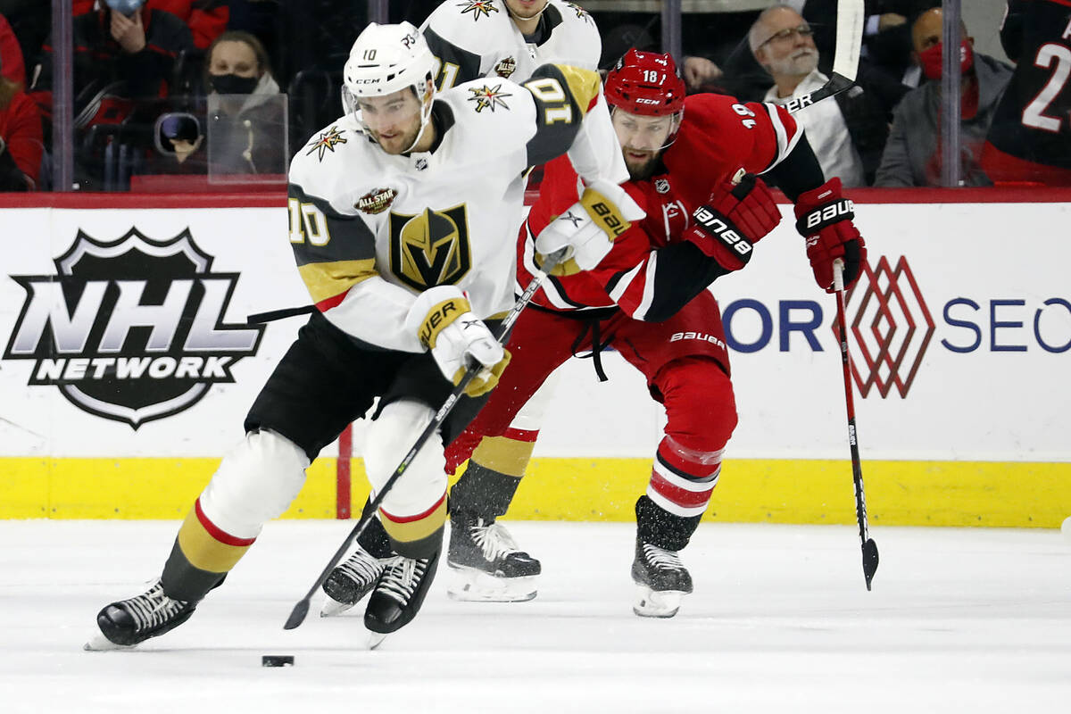Vegas Golden Knights' Nicolas Roy (10) brings the puck up the ice after taking it from Carolina ...
