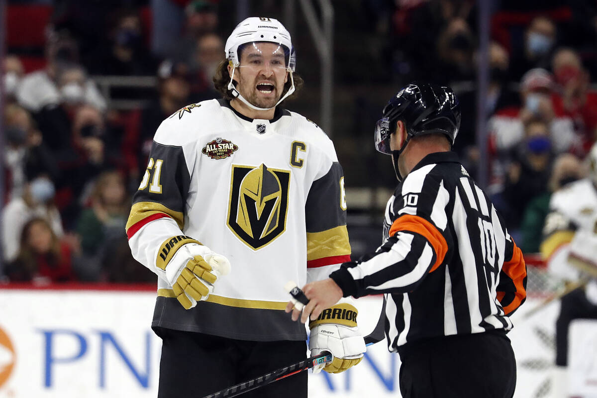 Vegas Golden Knights' Mark Stone (61) protests a call with an official during the third period ...
