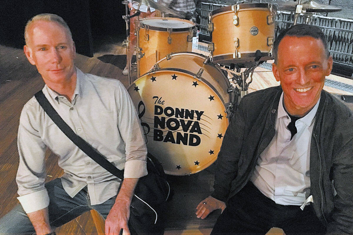 Richard Oberacker, left, and Robert Taylor are shown onstage with the drum kit from the Donny N ...