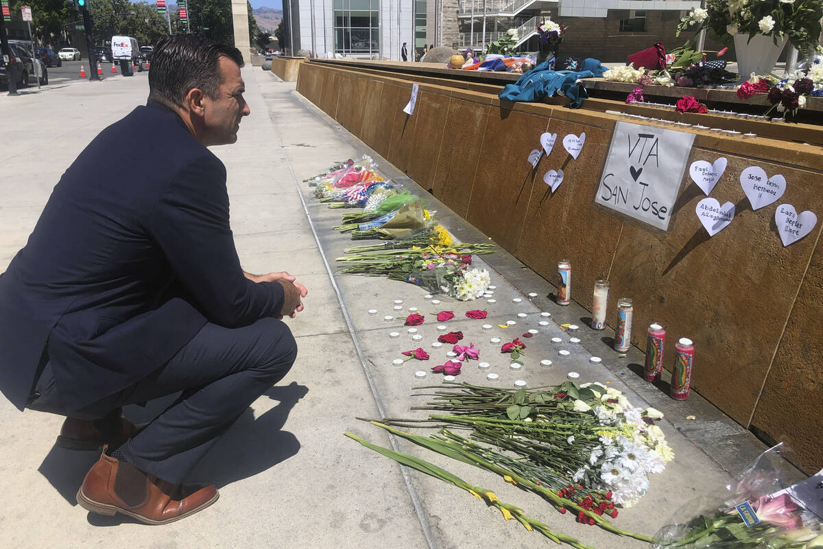 San Jose Mayor Sam Liccardo stops to view a makeshift memorial for the rail yard shooting victi ...