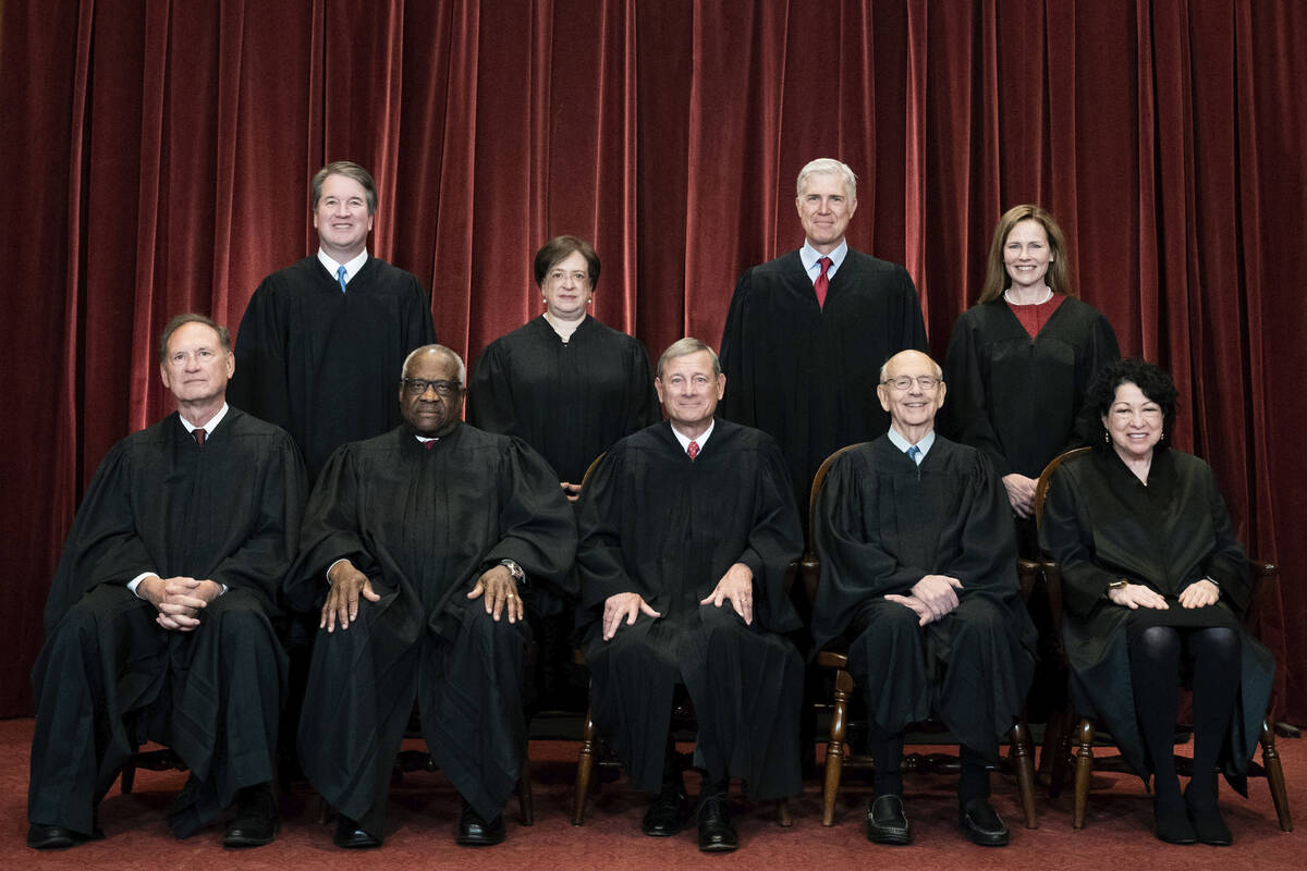 Members of the Supreme Court pose for a group photo at the Supreme Court in Washington, April 2 ...