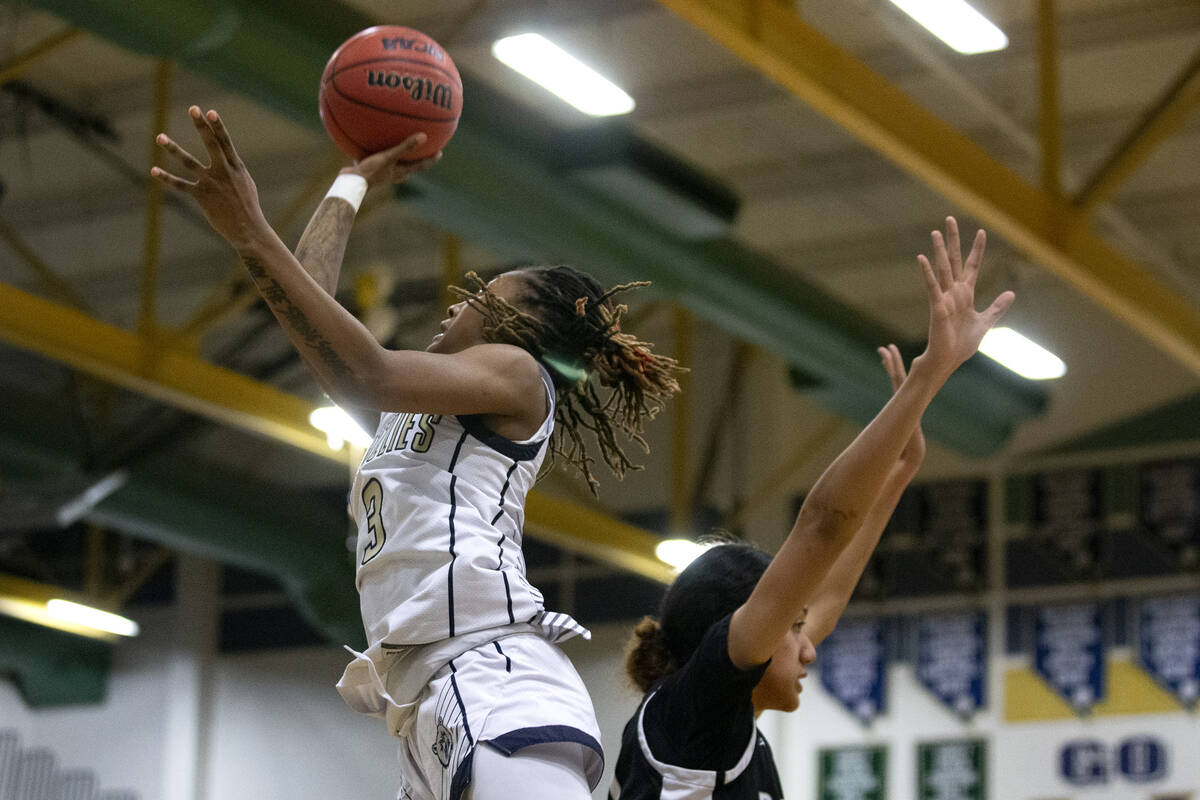 Spring Valley’s Aaliyah Gayles (3) shoots against Desert Oasis’ Lata Fakahufua (2 ...