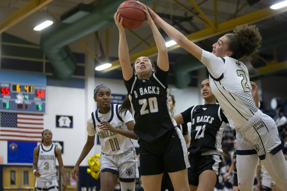 Spring Valley’s Grace Knox (2) blocks a shot by Desert Oasis’ Kacee Mich’l ...