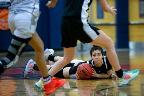 Desert Oasis’ Olivia Bigger looks to pass from the floor during a girls high school bask ...