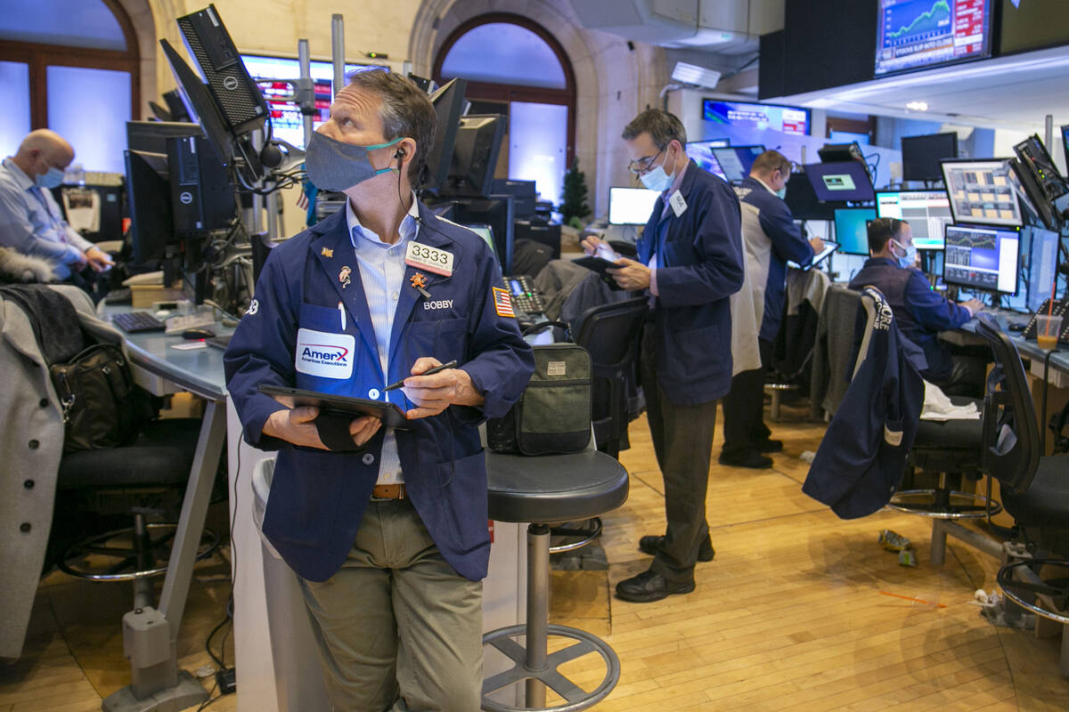 Traders work on the New York Stock Exchange floor in New York, Tuesday, Jan. 25, 2022. Stocks a ...