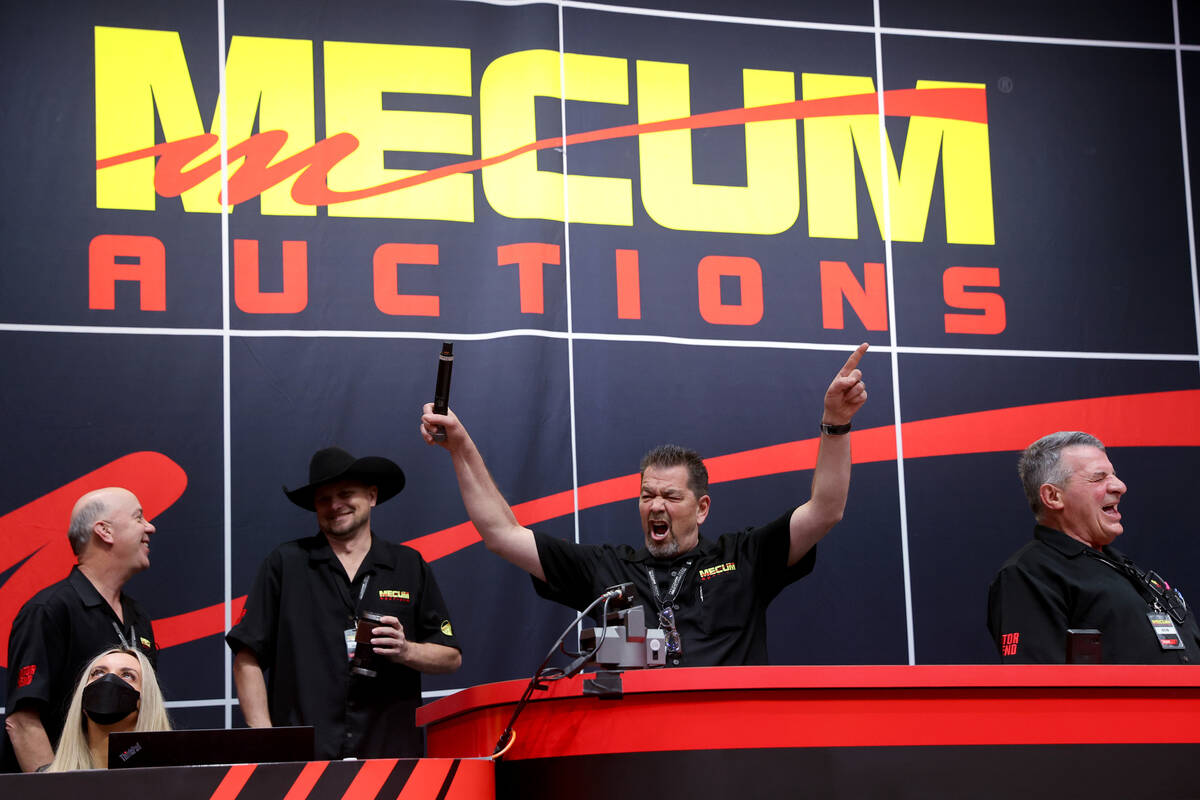 Auctioneer Jimmy Landis fires up the crowd at the Mecum Auctions vintage and antique motorcycle ...