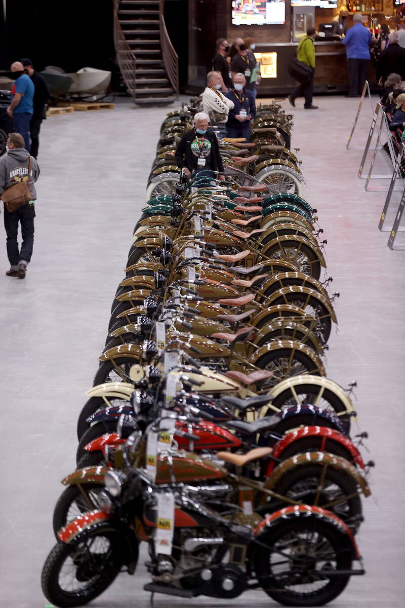 Bidders check out a 95-bike Harley-Davidson collection at the Mecum Auctions vintage and antiqu ...
