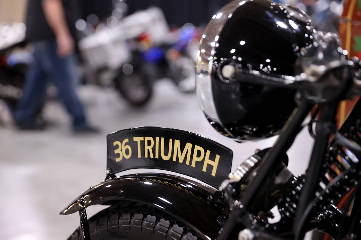 A 1936 Triumph 3/1 at the Mecum Auctions vintage and antique motorcycle auction at the South Po ...