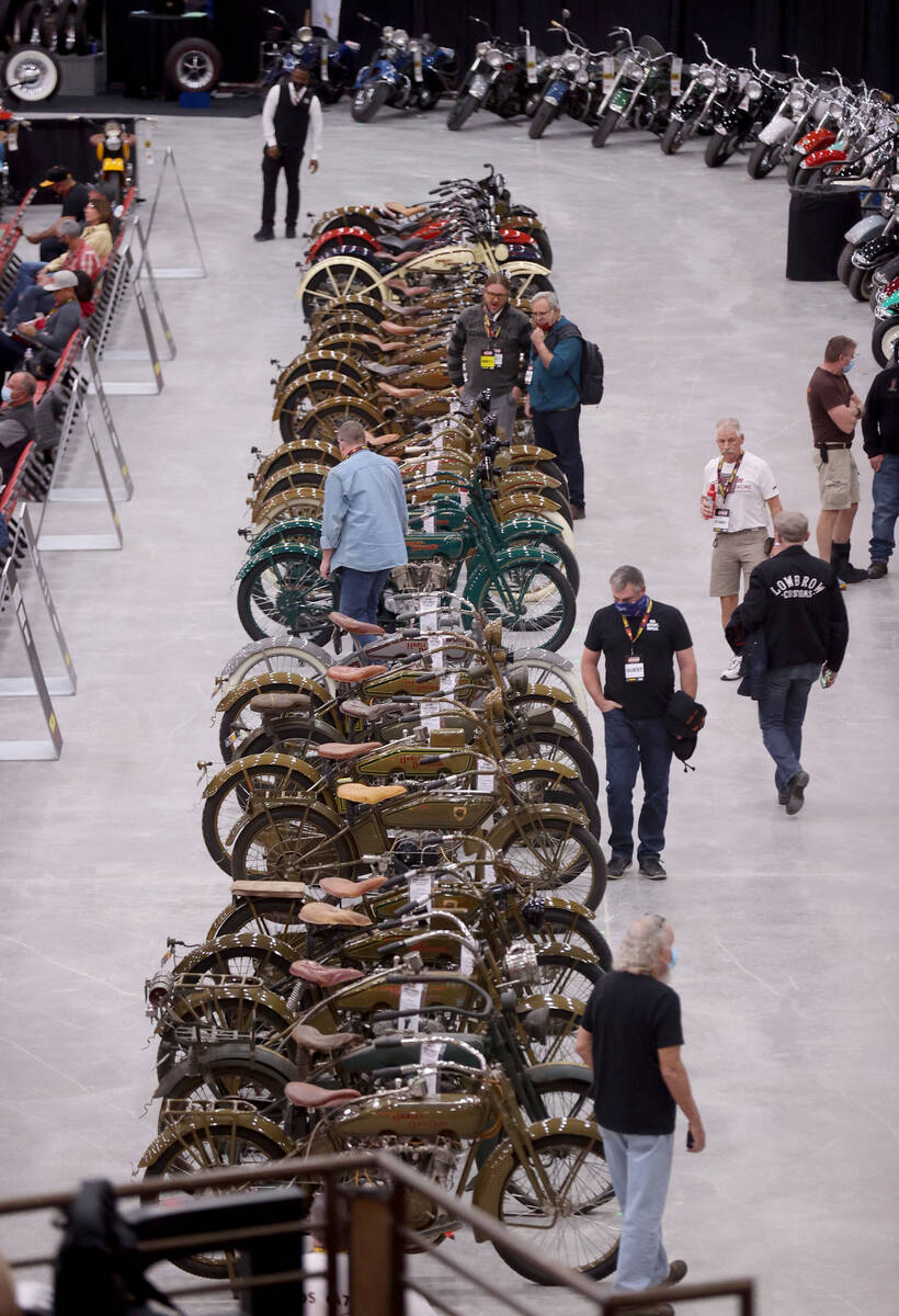 Bidders check out a 95-bike Harley-Davidson collection at the Mecum Auctions vintage and antiqu ...