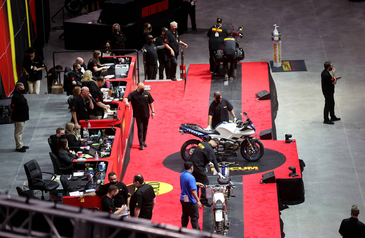 Auctioneer Russ Conklin calls bids at the Mecum Auctions vintage and antique motorcycle auction ...