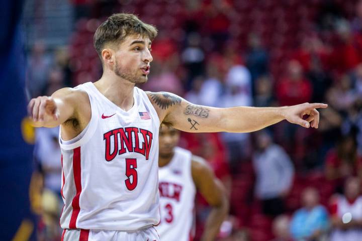 UNLV Rebels guard Jordan McCabe (5) directs his teammates after a foul for critical free throws ...