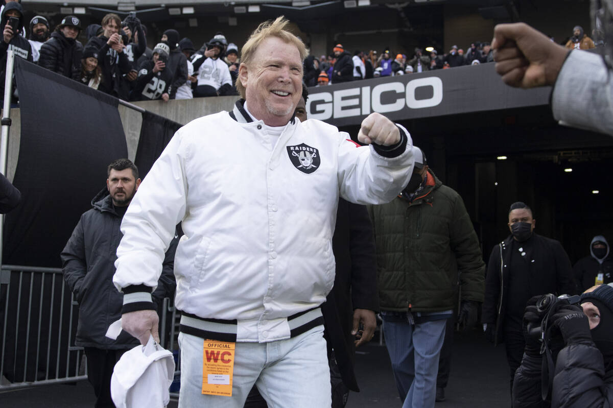 Raiders owner Mark Davis makes his way to the field before an NFL playoff game between the Raid ...