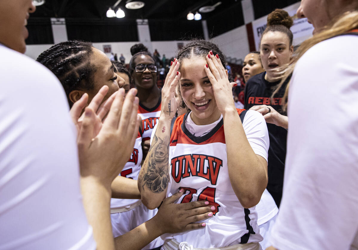 UNLV Lady Rebels guard Essence Booker (24) celebrates after reaching 1,000 career points and de ...