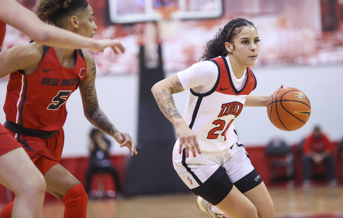 UNLV Lady Rebels guard Essence Booker (24) drives the ball against the New Mexico Lobos during ...