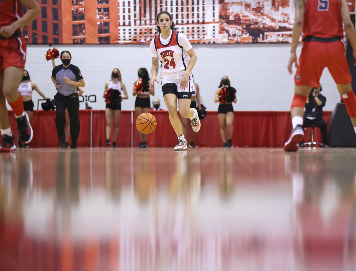 UNLV Lady Rebels guard Essence Booker (24) brings the ball up court against the New Mexico Lobo ...