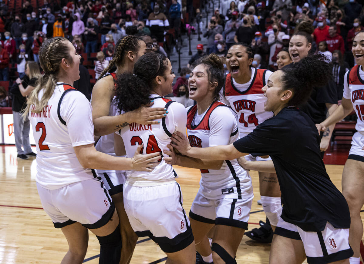 UNLV Lady Rebels guard Essence Booker (24) celebrates after reaching 1,000 career points and de ...