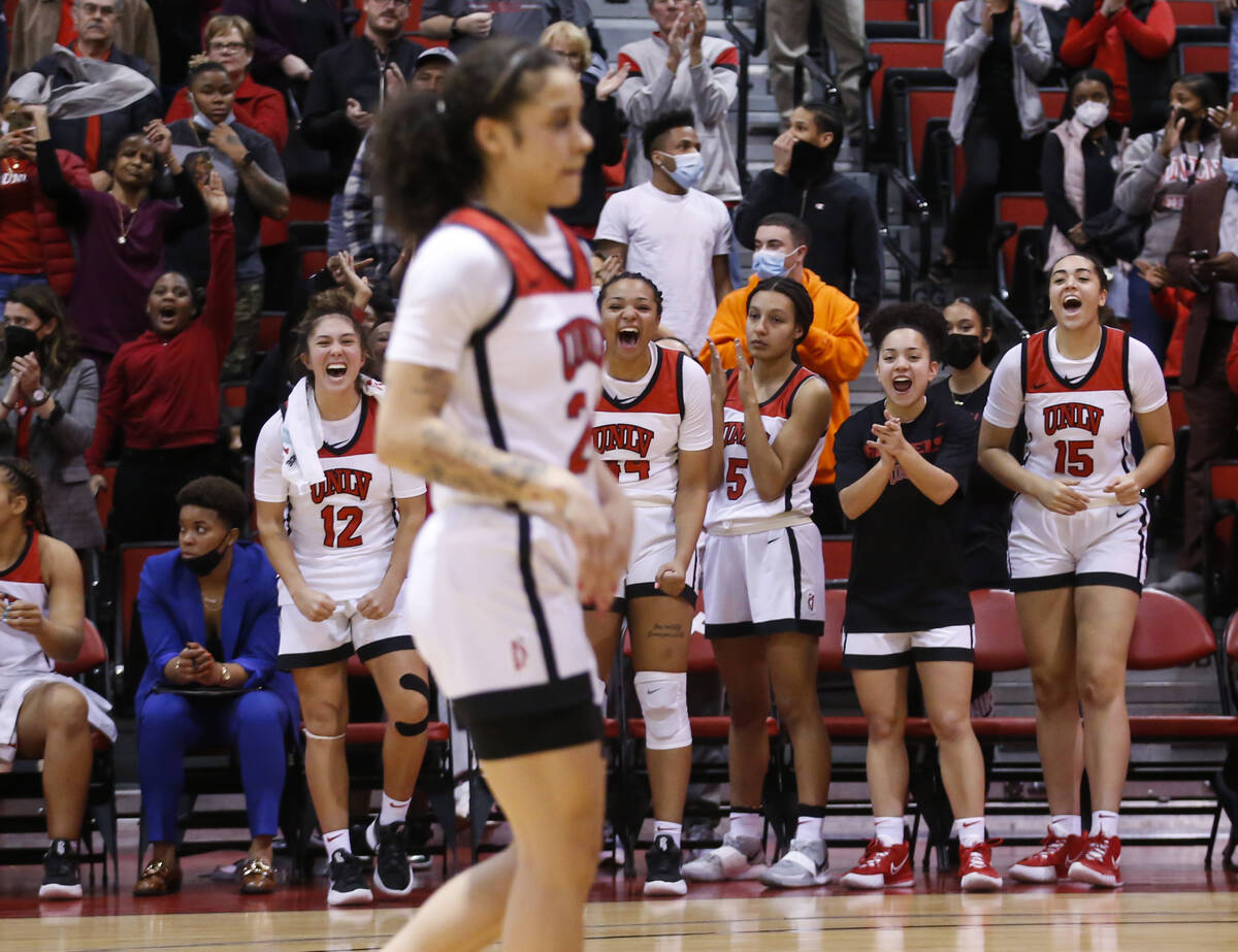 Teammates of UNLV Lady Rebels guard Essence Booker (24) cheer her on during the second half of ...