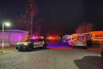 Las Vegas police at the scene of a mobile home fire on South Mojave Road on Wednesday, Jan. 26, ...