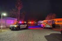 Las Vegas police at the scene of a mobile home fire on South Mojave Road on Wednesday, Jan. 26, ...