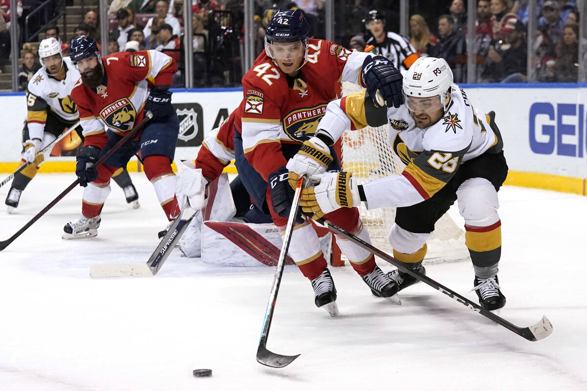 Florida Panthers Gustav Forsling (42) and Vegas Golden Knights left wing William Carrier (28) g ...