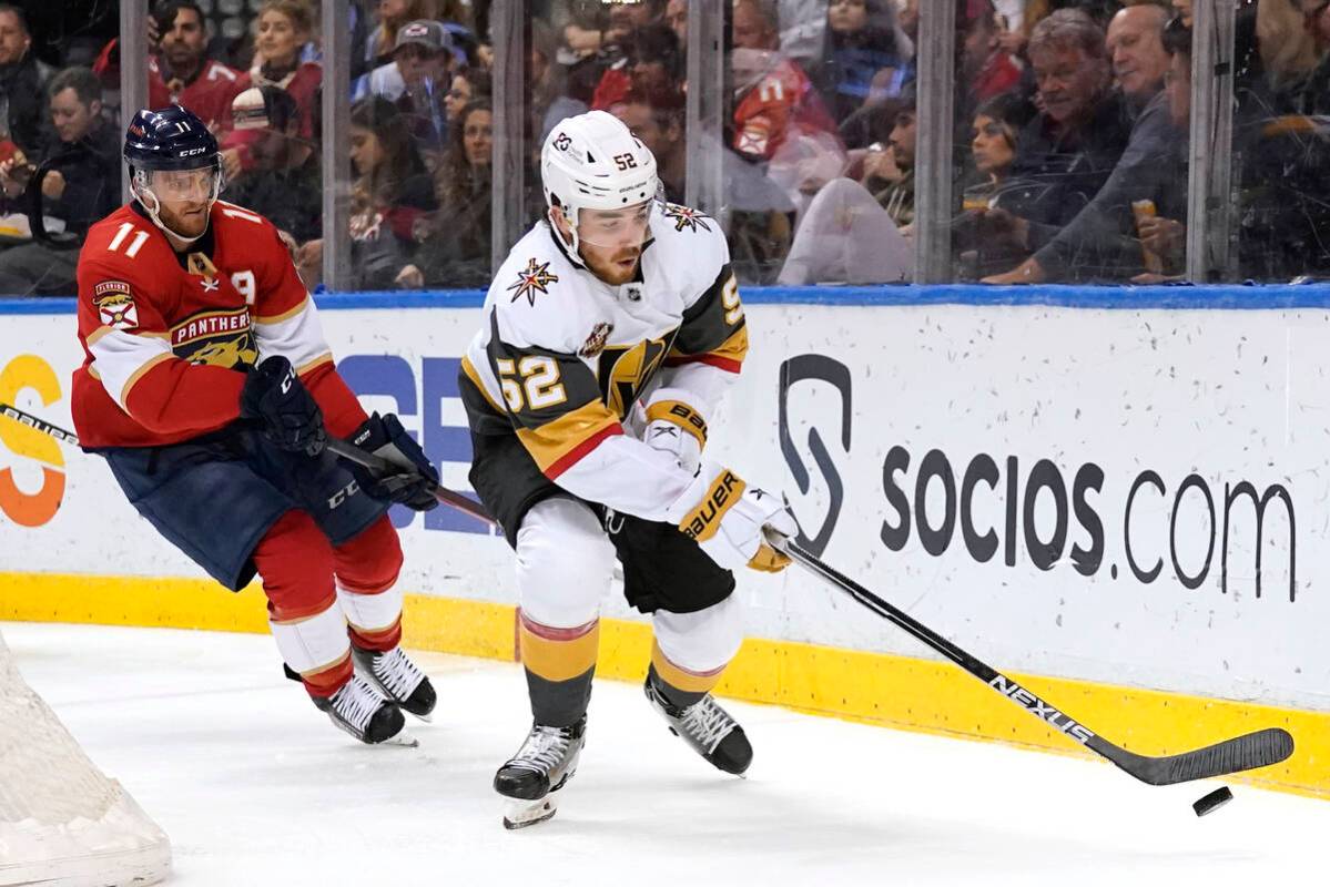 Vegas Golden Knights defenseman Dylan Coghlan (52) skates with the puck as Florida Panthers lef ...