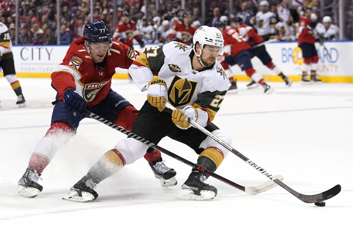 Vegas Golden Knights defenseman Shea Theodore (27) skates with the puck as Florida Panthers cen ...