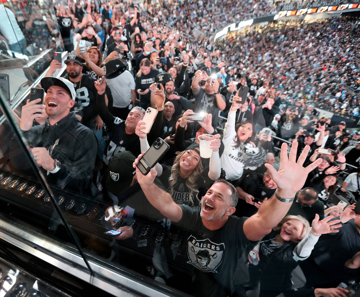 Fans cheer as Lil Jon performs with members of the Raiderettes during halftime as the Raiders t ...