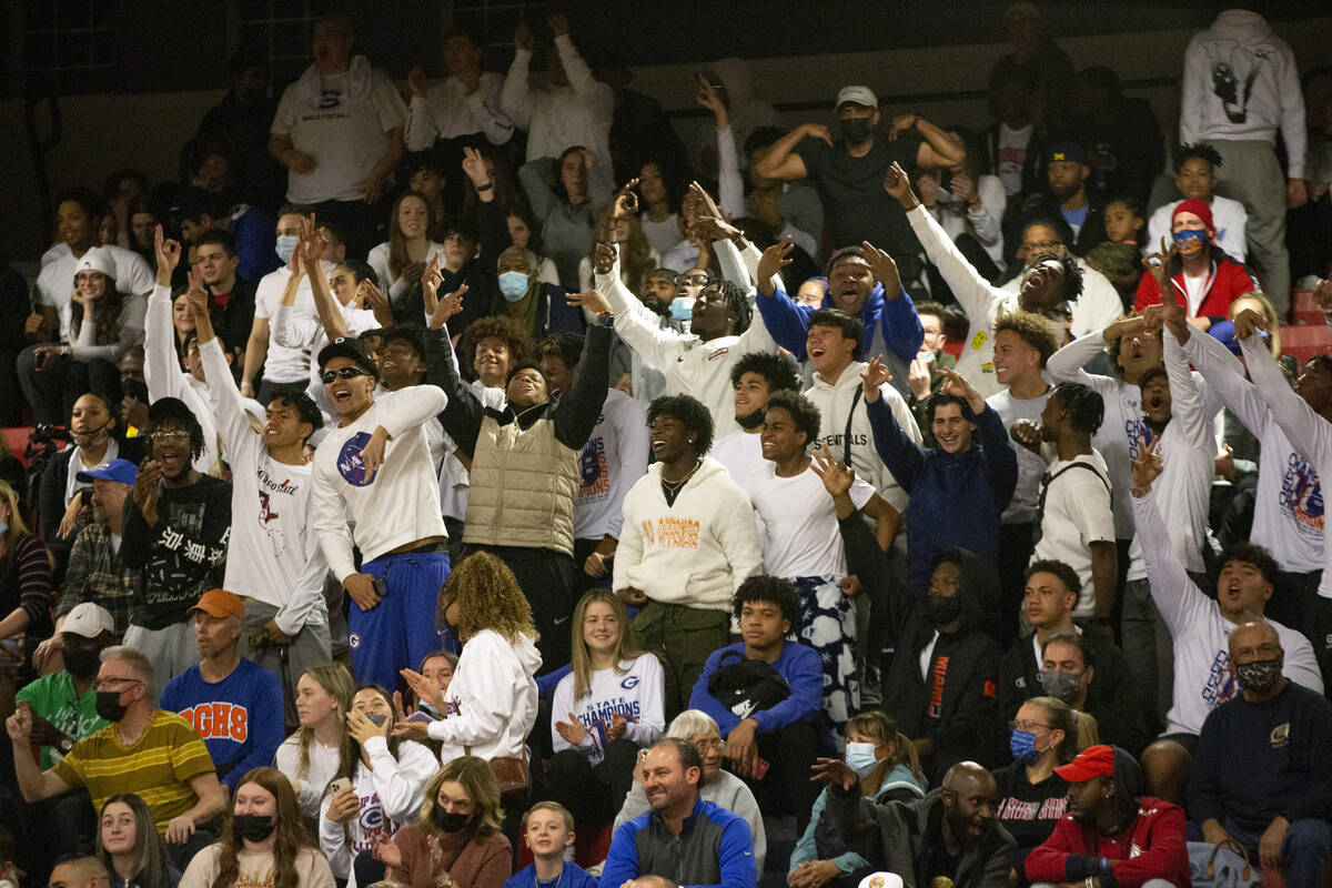 Bishop Gorman fans cheer after their team scored against Liberty during the first half of a boy ...