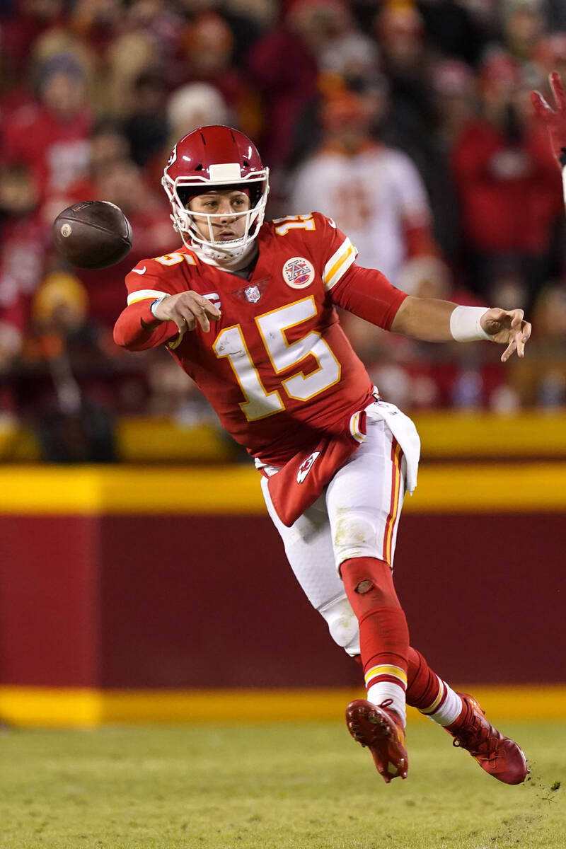 Kansas City Chiefs quarterback Patrick Mahomes throws a sidearm pass during the first half of a ...