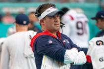 New England Patriots offensive coordinator and quarterbacks coach Josh McDaniels watches from t ...