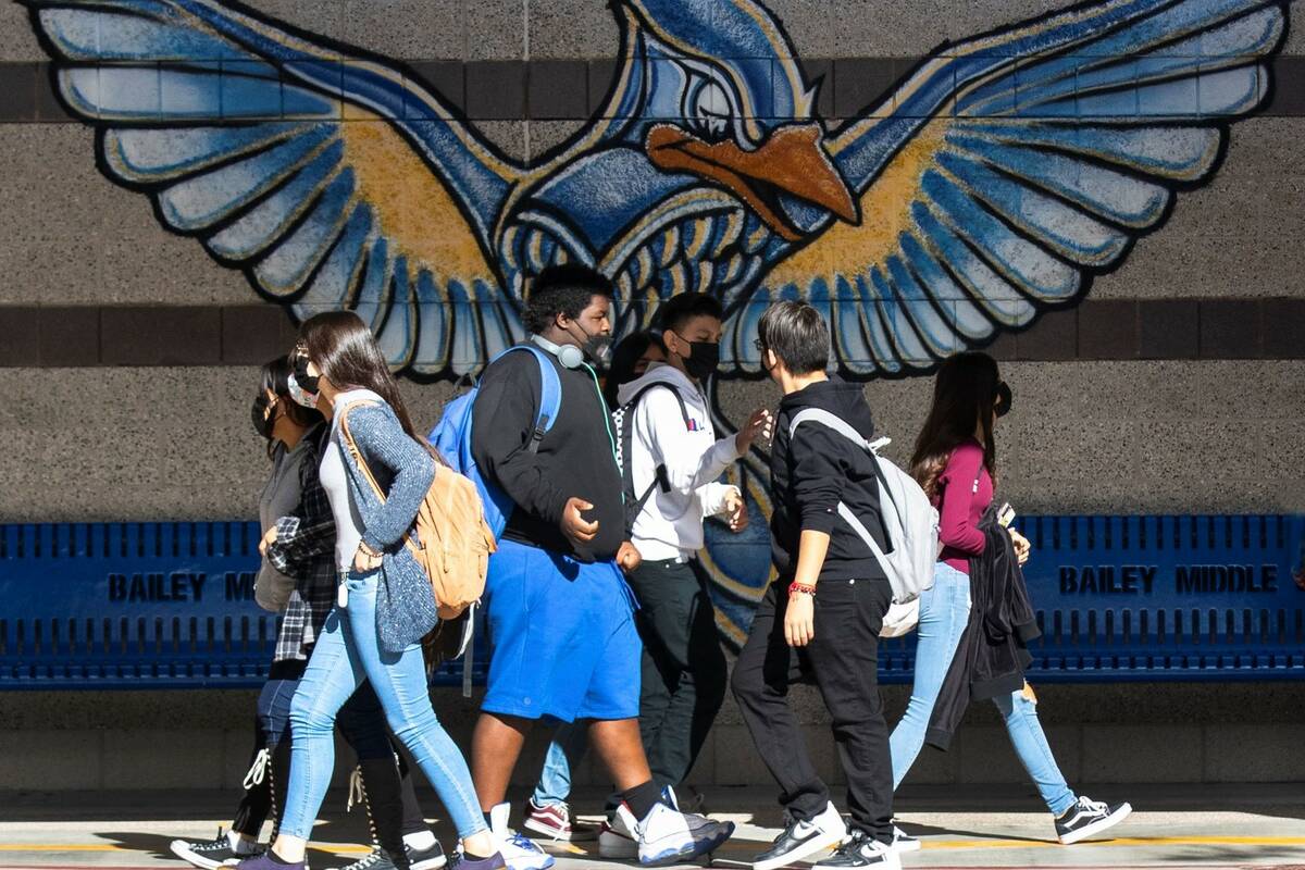 Students at Bailey Middle School walk in the hallway during recess on Friday, Dec. 10, 2021, in ...