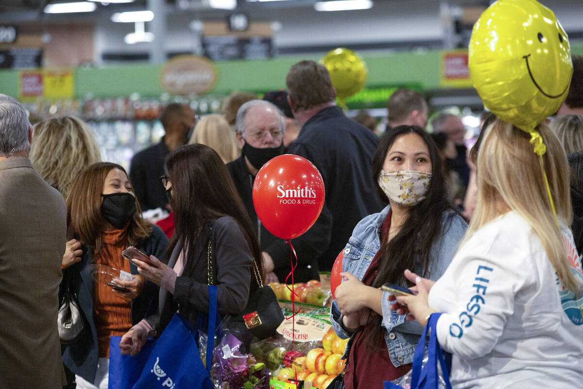 Smith’s store associates, company staff and neighborhood community members attend a prev ...