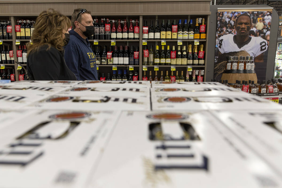 Beer, wine and liquor is displayed during a preview celebration for the new Smith’s Mark ...