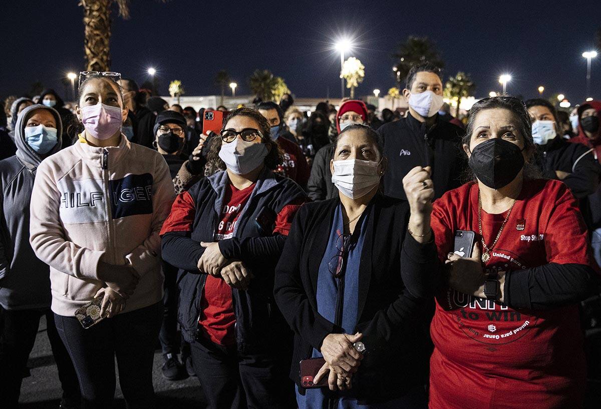 Culinary Union guest room attendants, including Rocio Omar, second left, Amparo Muneton, and Ma ...