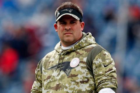 FILE - New England Patriots offensive coordinator Josh McDaniels looks on prior to an NFL footb ...