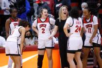 UNLV Lady Rebels head coach Lindy La Rocque shares a laugh with her players, guards Kenadee Win ...