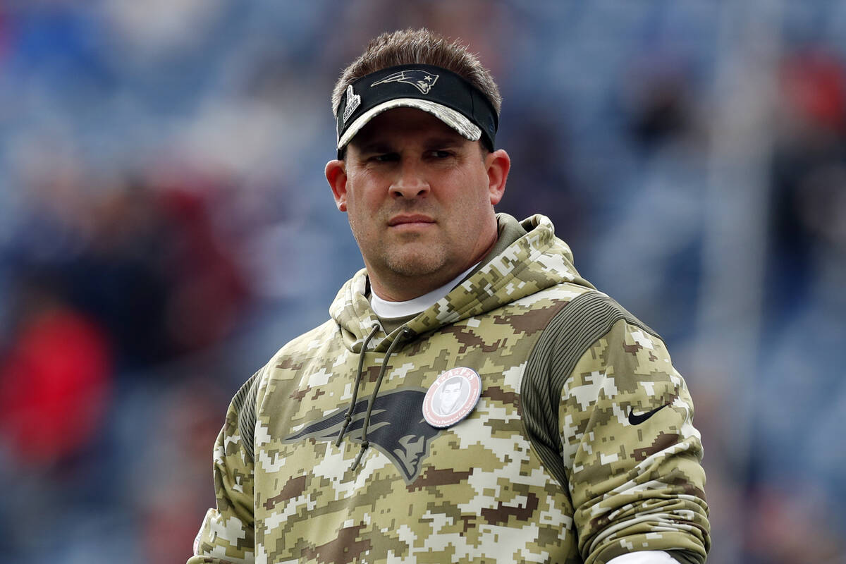 New England Patriots offensive coordinator Josh McDaniels looks on prior to an NFL football gam ...