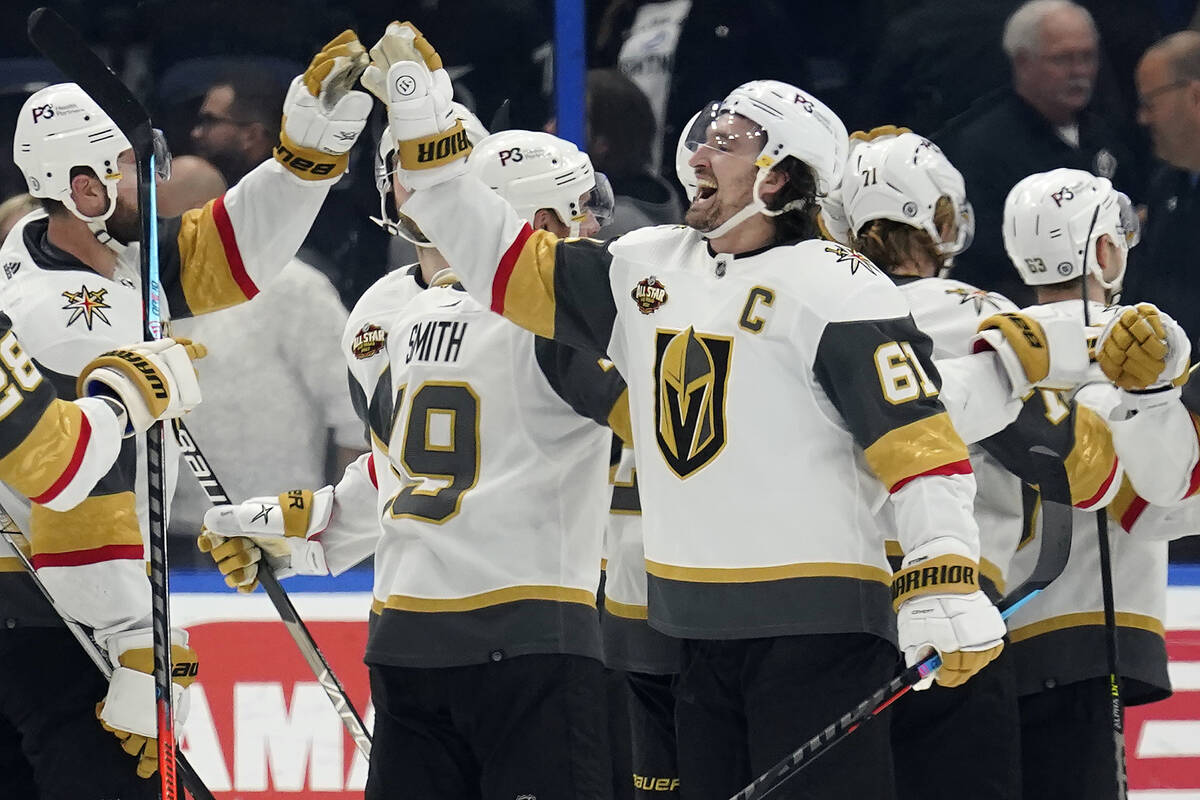 Vegas Golden Knights right wing Mark Stone (61) celebrates with teammates after scoring the gam ...