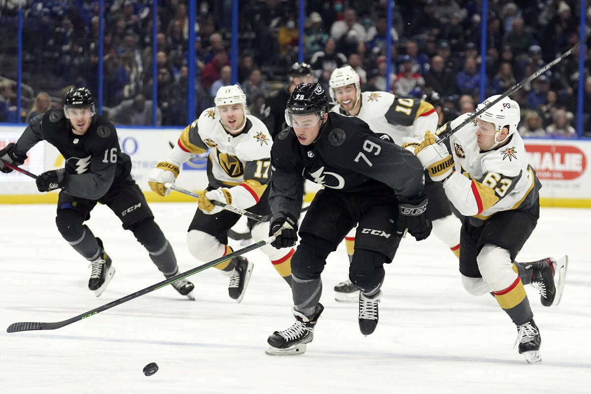 Tampa Bay Lightning center Ross Colton (79) breaks out past Vegas Golden Knights right wing Evg ...