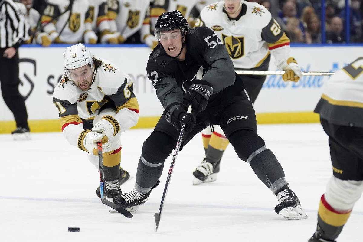 Tampa Bay Lightning defenseman Cal Foote (52) and Vegas Golden Knights right wing Mark Stone (6 ...