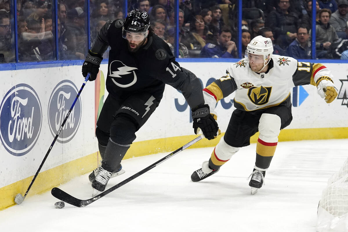 Tampa Bay Lightning left wing Pat Maroon (14) moves the puck ahead of Vegas Golden Knights defe ...