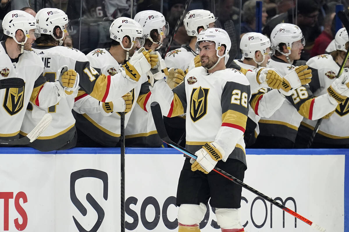 Vegas Golden Knights left wing William Carrier (28) celebrates with the bench after his goal ag ...