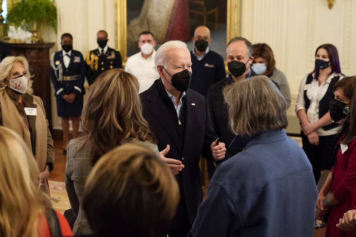 President Joe Biden speaks with spouses of members of the National Governors Association after ...