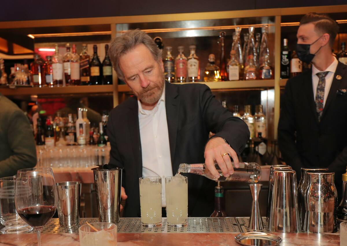 "Breaking Bad" co-star Bryan Cranston mixes a drink with his Dos Hombres mezcal at Carversteak ...